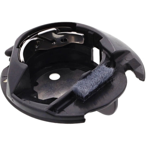 Bobbin case for sewing machines, black plastic with attached lint brush.