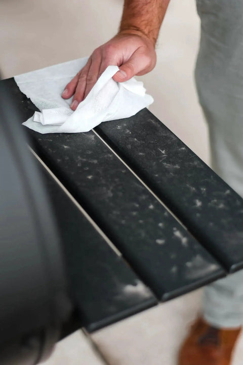 Hand cleaning outdoor grill with Plant Based Grill Cleaning Wipes Aloe And Vitamin E Safe On Surfaces Large 15X10