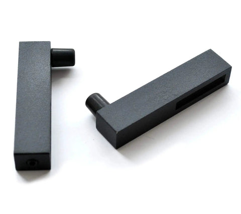 Close-up of two black iron track connectors from Ornate Cut Roller Black Iron Sliding Barn Hardware Kit For Single Door Hardware Only, Door Not Included 5 Foot Track With Wall Mount Supports Up To 270 Lbs Fits Doors Up To 30 Inches Wide And 1 3 8 To 1 3 4 Inches Rollers Stoppers Track Connectors.