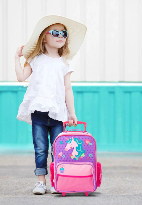 Young girl with a unicorn-themed Kids Rolling Luggage For Travel And Sleepovers With Durable Wheels Lightweight Carry On Suitcase