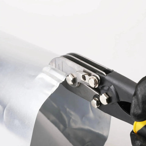 Close-up of Five Blade Sheet Metal Crimper For Ductwork Downspouts And Stove Pipes Industrial Grade Heavy Duty Hand Crimping Tool in use