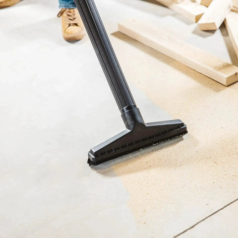 All Purpose Wet Dry Vac Attachment Kit For Home And Shop Use with floor brush in use on sawdust-covered floor