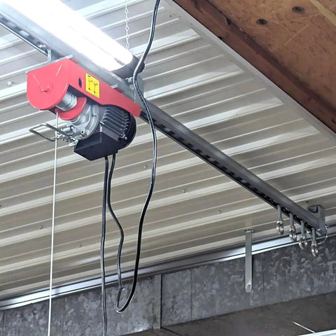 Four Wheel Unistrut Trolley Rollers Heavy Duty 650 Pound Capacity installed on ceiling track with lifting eye nut and M12 bolt