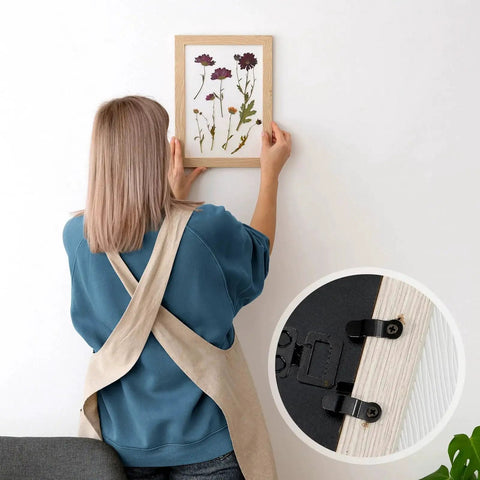 Person hanging photo with 100 Piece Metal Picture Frame Turn Button Fasteners With Screws For Hanging Photos Posters Drawings And Crafts Backing Clips Black All In One Framing Hardware Kit