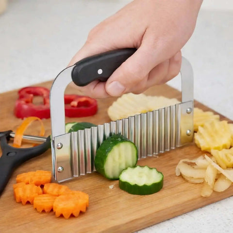 Hand using Crinkle Cutter And Waffle Fry Cutter Set With Peeler For Potatoes And Vegetables, Stainless Steel Kitchen Tool for crinkle fries