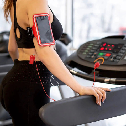 Person using treadmill with Two Pack Universal Treadmill Magnetic Safety Keys Round Emergency Stop Magnets Replacement for workouts