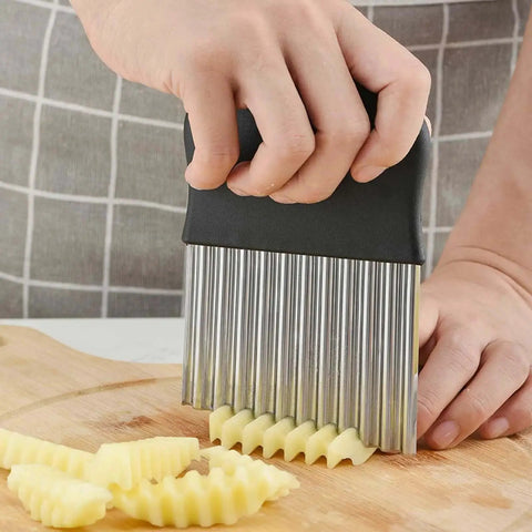 Person using Stainless Steel Crinkle Cutter Wavy Chopper For Potatoes And Carrots French Fry Slicer Pro Grade Kitchen Gadget