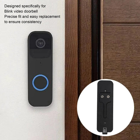 Sturdy Black Back Plate Mount Accessory For Video Doorbell Quick Install And Easy Repair next to a wooden door