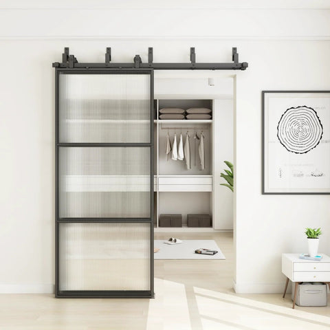 Bypass Glass Barn Door Kit With Double 6-Foot Hardware, installed sliding door in black carbon steel frame with reeded glass.