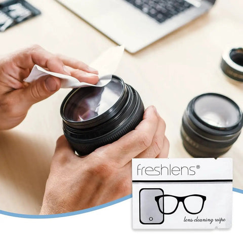 Hands cleaning a camera lens with a sheet from Lint-Free Lens Wipes, 50 Pre-Moistened Towelettes for Glasses and Screens packet.