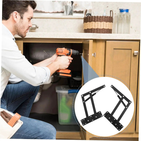Man installing Drop Leaf Hinge Set One Pair For Cabinets And Folding Furniture Built To Last Ideal For Folding Beds Sofas And Lifting Doors With Easy Installation And High Load Capacity Spring Loaded Cupboard Hinges By Romisbaba under a kitchen sink.