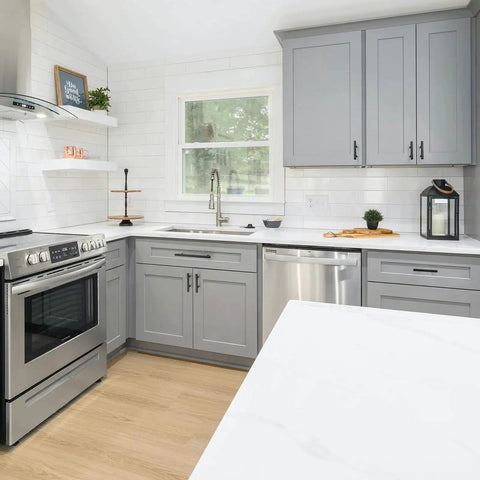 Modern kitchen with gray cabinets featuring Matte Black Square Cabinet Handles 30 Pack Stainless Steel Pulls for Kitchen and Drawers.
