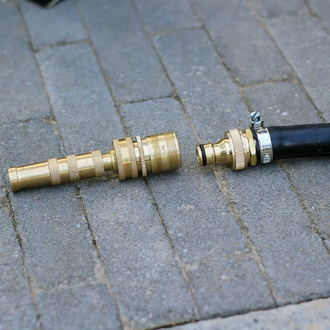 Brass garden hose quick-connect fittings, 3/4 in GHT, two sets with male and female adapters beside a black hose.