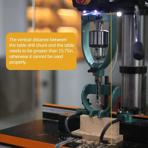 Mortising Attachment Kit For Drill Press And Woodworking Pros With Locator, Press Block, Side Positioning Rod, Fixed Seat, And Four Chisel Sizes One Quarter Inch, Three Eighths Inch, One Half Inch, And Five Eighths Inch, High Quality Steel Drill Bit in use on a drill press with a wooden block.
