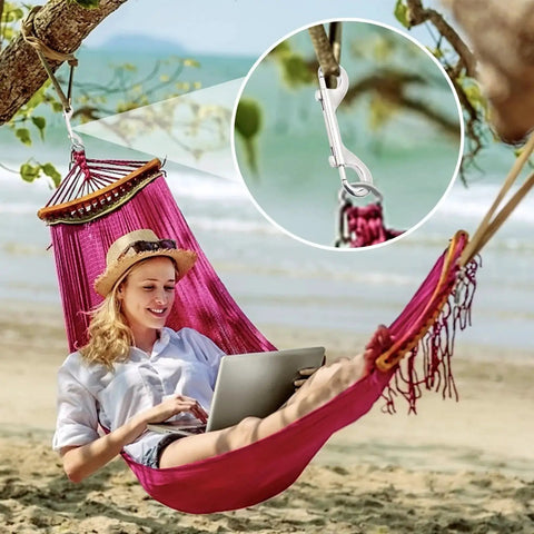 Double Ended Bolt Snap Hooks 4.7 Inch Heavy Duty Zinc Alloy 220 Lb Load securing a hammock on a tree at a beach.