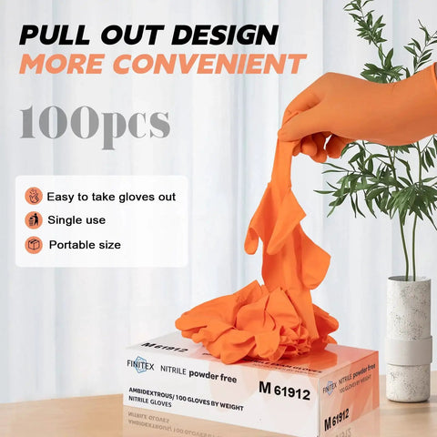 Person pulling an orange glove from a Nitrile Disposable Gloves Orange 3.5mil Medium 100 Count Powder Free Exam box on a table.