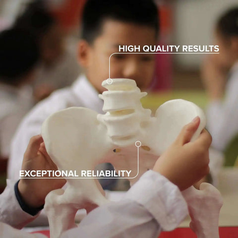 Child holding a 3D printed model made from White 1.75mm PLA 3D Printer Filament, 1kg Spool, Easy To Print With High Speed Extrusion