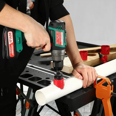 Person using Bi Metal Hole Saw Kit With Mandrels And Case HYCHIKA, 17 Pc High Speed Steel Hole Saw Set For Metal PVC Wood And Plastic on PVC pipe