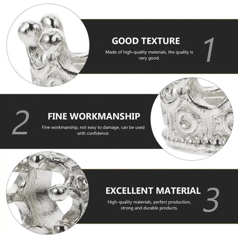 Close-up view of 50 Piece King Crown Charms 3D Mini Alloy Beads showcasing texture and workmanship in silver tone for DIY jewelry.