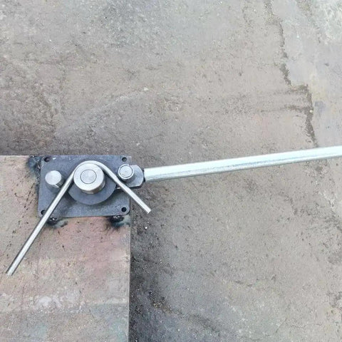 Heavy Duty Rebar And Rod Bender For Metalworking installed on concrete, with handle extended for bending steel rods up to 5/8 inch