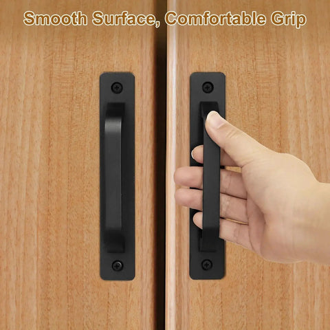 Hand gripping 2 Pcs Barn Door Handle Set Black Aluminum Alloy 7.09 Inch Door Pull Handles installed on wooden doors