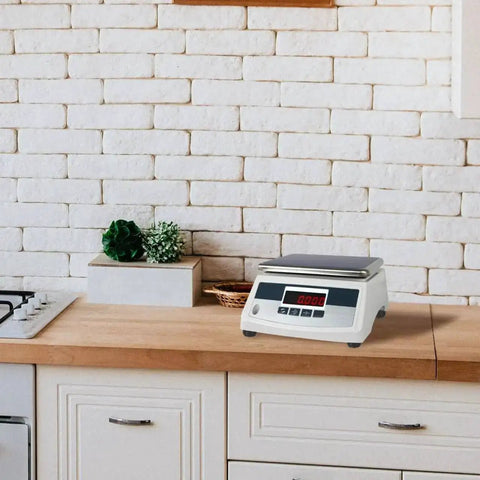 Electronic platform scale placed on a kitchen countertop with 4 Pack Replacement Scale Feet For Electronic Platform Scales With Shock Absorber Design.