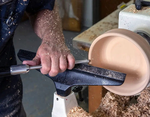 Person using Five Piece Mid Size Carbide Woodturning Tools Set with interchangeable handle on wood lathe.