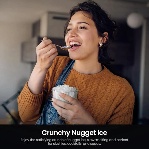 Person enjoying nugget ice from countertop portable nugget ice maker, illustrating crunchiness and slow-melting qualities.