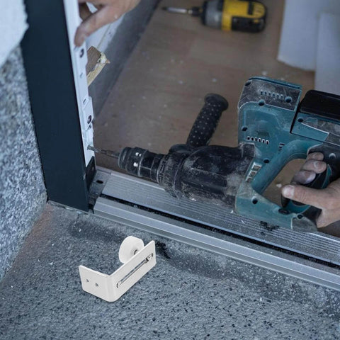 Installation of Sliding Barn Door Floor Guide With Wall Mount Track Hardware, showing heavy-duty double wheel rubber stopper.