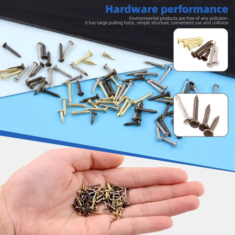 Hand holding small gold, silver, and bronze nails with scattered 1600Pcs Tiny Nails Kit With 1x6mm 1x8mm 1x10mm Wooden Nails In Gold Silver Bronze.