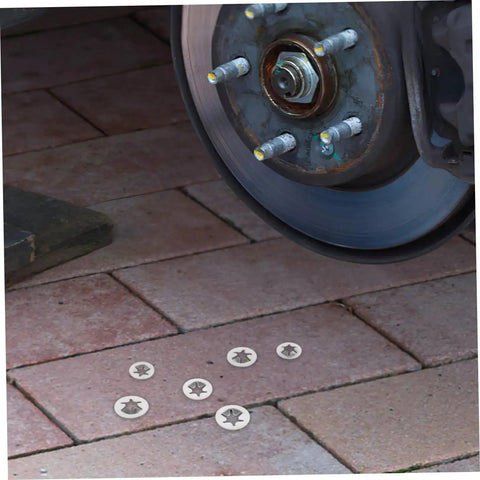 Stainless Steel Retaining Ring Assortment Kit With 30 Pieces Heavy Duty Snap Ring Sets displayed near automotive wheel on brick surface