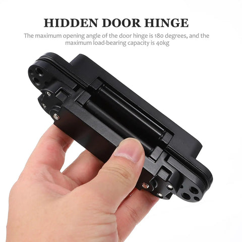 Heavy Duty Built Tough Invisible Door Hinge With 3D Adjustable Metal Cross Hinge And 180 Degree Swing Supports 40kg Load Concealed Door Hardware For Wooden Doors And Frames Left Or Right Opening shown in hand.