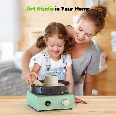 Child using Mini Pottery Wheel Kit With 6 Inch Turntable Two Way Rotation Metal Frame And Removable Splash Tray with adult supervision
