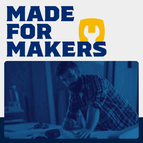 Man in workshop planning project under 'Made for Makers' sign