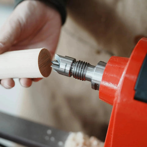 Four Prong Spring Loaded Spur Drive Center For 2MT Wood Lathe Woodturning Tools With One Inch Diameter And Spring Retracting Center Pin For Strong Grip And No Slipping During Turning installed on a wood lathe