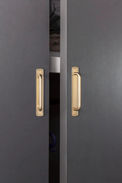 Champagne Bronze Cabinet Pulls With Bead Edge Backplates, 5 Inch Hole Centers, Solid Zinc Alloy Construction, installed on gray cabinets