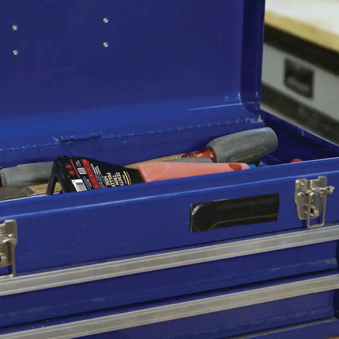 Lightweight Trim Puller Mini Multi Tool For Tight Spaces in a blue toolbox, showcasing its compact size and utility for quick trim removal