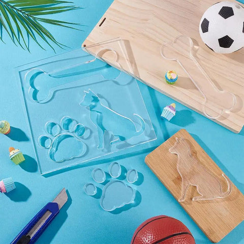 Clear Acrylic 3 In 1 Dog Bone And Paw Router Template Set For Woodworking No Fuss Reusable Jig Stencils For DIY Projects Bee Inlay Inspired Craft Templates 7.8 Inch Square 6mm Thick on blue surface with craft tools