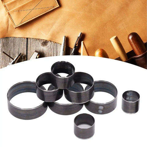 Eight Piece Round Leather Cutting Die Set With Alloy Steel Punching Tools 25 To 60mm shown on a leatherwork table.