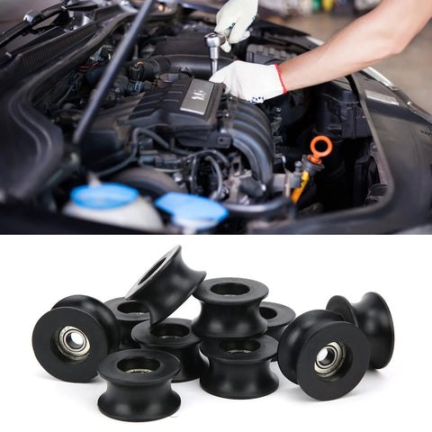 Roller pulley rail being installed in a car engine bay by a mechanic
Ten black nylon-coated U-shaped roller pulleys with 608ZZ bearings