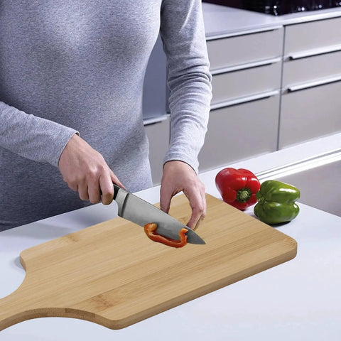 Bulk 25 Pack Mini Charcuterie Boards Set For Pizza Bread Cheese Fruit And Serving Bamboo Cutting Boards With Handle 11 By 5 Inch Laser Engraving Ready Great For Gifting DIY Projects Eco Friendly Kitchen Essentials in use for slicing red bell pepper on kitchen countertop.