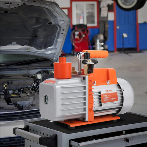 VEVOR 7 CFM dual-stage HVAC vacuum pump, 1/2 HP rotary vane, orange/gray housing with oil bottle for car repair.