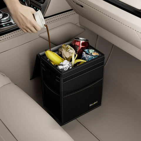 Leakproof 2 Gallon Car Trash Can With Lid Black Waterproof Organizer For Cars With Adjustable Straps That Mount Anywhere For A Clean Ride That Keeps Spills Contained Odors Locked Down in car with debris inside.