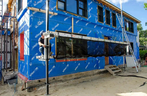 Aluminum Pump Jack 2000 Adjustable 12 To 24 Inches Scaffold System For Siding installed on house exterior for siding work