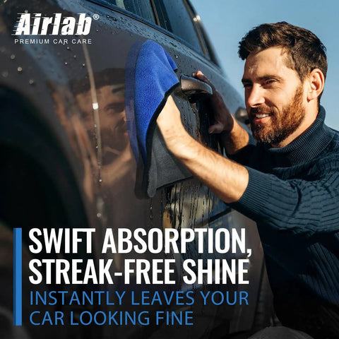 Man using Ultra Thick 800GSM Microfiber Towels For Cars Pack Of 4 16 X 16 Inches Blue Gray for auto detailing.