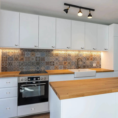 Modern kitchen with Retro Ceramic Cabinet Knobs Set of 4 1-1/4 Inch White Vintage Round Drawer Pulls installed on white cabinets.