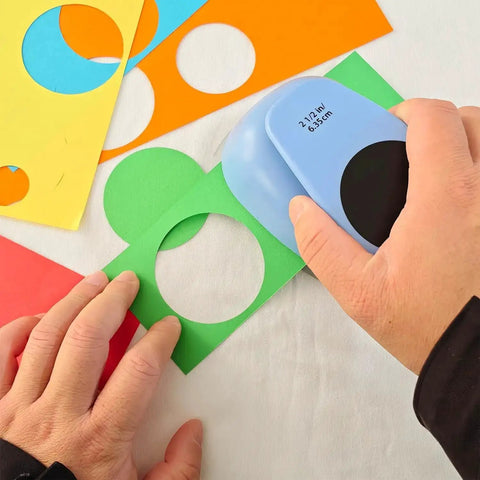 Using Two And A Half Inch Circle Hole Punch Cutter For Paper Crafts Cardstock Gift Wrapping And Scrapbooking on colorful paper