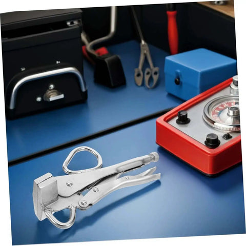 Tough As Nails Heavy Duty Auto Body Frame Clamp with Extra Wide Duckbill Jaw on workshop table, used for welding and car repair