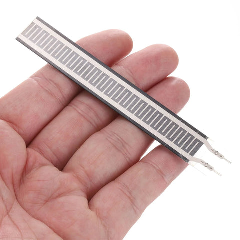 MECCANIXITY FSR408 thin-film pressure sensor strip with interdigitated electrodes, held in hand