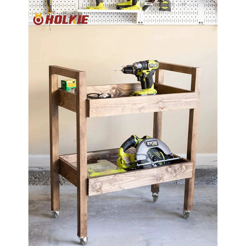 Wooden cart with 3 inch swivel caster wheels, tools on shelves, showcasing mobility in workshop setting. 600 pound load capacity, grey casters.